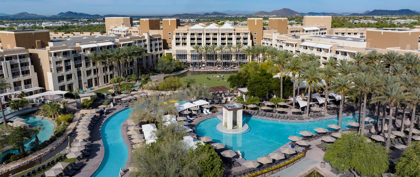 Aerial photo of the hotel and pool.