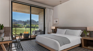 Image of a single bed in a Vineyard-View Room with Balcony.