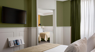 A view from one bedroom looking into the connecting room.