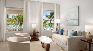 Image of a seating area and windows in a Three-Bedroom Oceanfront Suite.