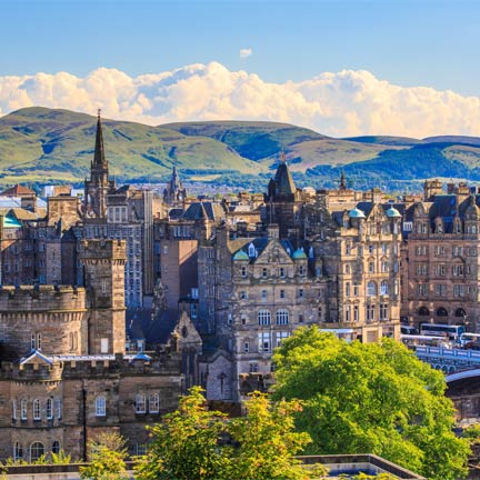 Image of a castle on a hill from the town below.