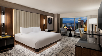 Image of a bed and large window in a Restore MGM Room.