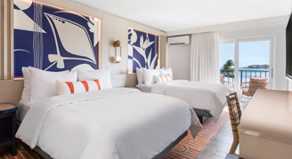 A room with a view, two queen beds, and a balcony.