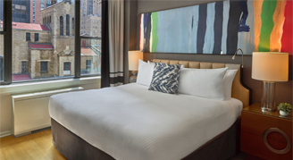 Image of a bed and window in a Guest Room