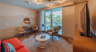Image of a living area leading to a balcony in an Island Suite.