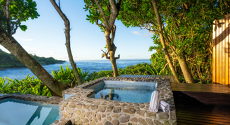 A view looking out towards the ocean seeing the plunge pool in the foreground.