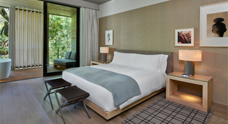 Image of a single bed in a Deluxe Streamside Suite.