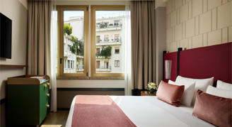 Photo of Premium Room with king bed and large windows.