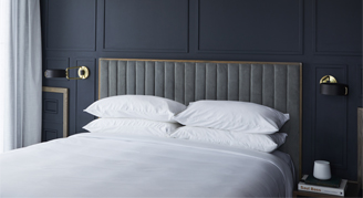 Image of a single bed in a Designer Suite.