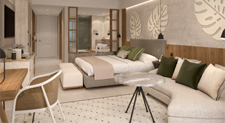 Tropical print wall with neutral toned bedroom and a side sofa 