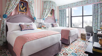 Graduate Room featuring two queen beds and an accessible shower.