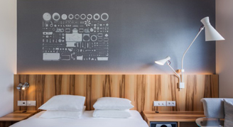 View of a single bed with night stands with simple decor.