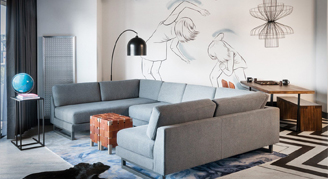 Photo of large couch and dining table.