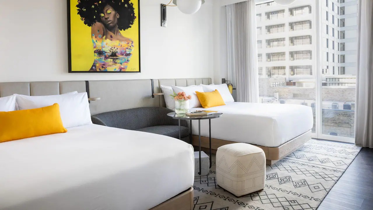 Photo of a hotel room with two queen beds.