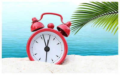 Red clock on the beach