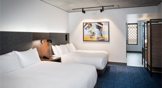 Photo of two queen beds.