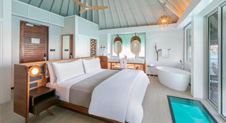 Image of a single bed in a Island-View Overwater Bungalow.
