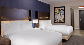 A view of the two queen beds in the Standard Room.
