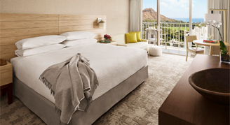 Image of a single bed in a Diamond Head Ocean-View Room.