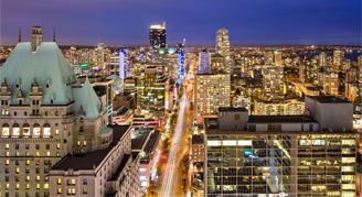 Image of the city from the window of a City-View Balcony Room.