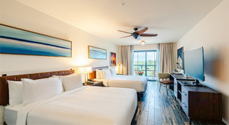 Image of two queen beds  in a River-View Room with Balcony.