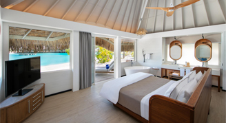 Image of a single bed in a Lagoon-View Beach Villa with Plunge Pool room.