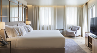 Image of a single bed in a Premium Room.