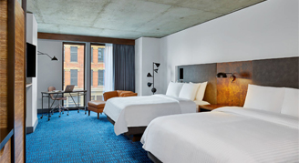 Photo of two queen beds.