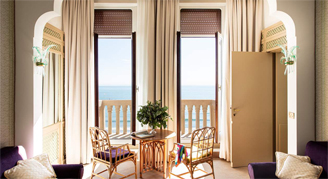 Image of a small table leading to a balcony in a Suite room.