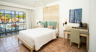 This image shows a king-size bed with a private balcony. 