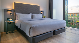 Photo of hotel room bed.