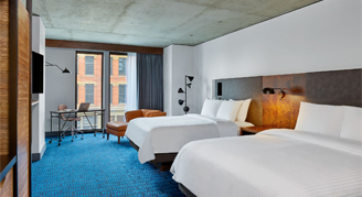 Photo of two queen beds.