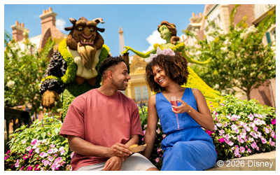 Couple eating next to Beauty and the Beast plant art