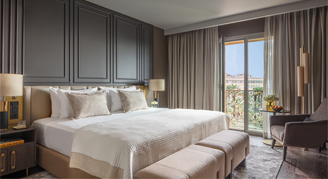 Image of a single bed in a Sea-View Premium Room with Balcony.