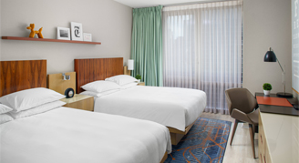 Image of two beds in a Room.