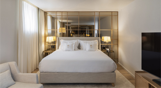 Image of a single bed in a Cathedral-View Suite with Balcony.