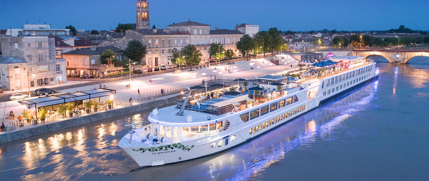 Uniworld Boutique River Cruises ship the S.S. Bon Voyage docked in Bordeaux, France at dusk