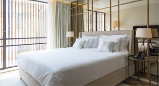 Image of a single bed in a Premium Room.