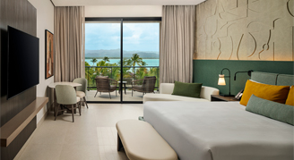 Photo of Club Azure Ocean-View Room with one king bed.
