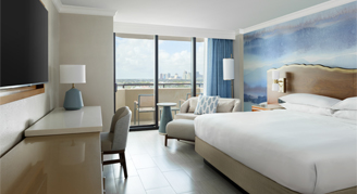 This Room featuring a king bed and a balcony