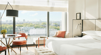 Image of a single bed with a window in a River-View Room.
