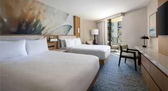 Photo of hotel room with two queen beds.