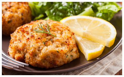 Plate of crab cakes and lemon slices