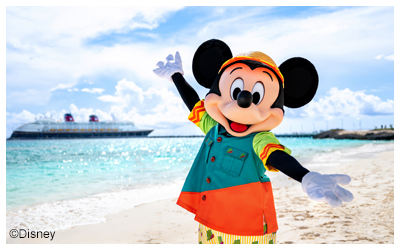 Mickey Mouse on the beach of Lookout Cay with a Disney Cruise Line ship in the background