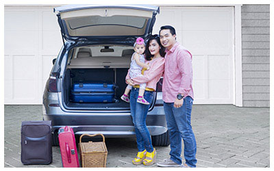 Image of a family going on vacation with their rental car.