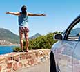 Image of a young woman and a rental car.