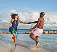 Image of a couple having fun on the beach.