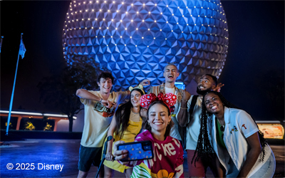 Young people taking a selfie in front of EPCOT